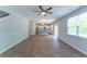 Open-concept living space seamlessly connects to the kitchen, featuring wood-look floors and ample natural light at 131 Cloverleaf St, Summerville, SC 29483