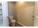Powder room featuring a toilet and a patterned wallpaper at 131 Cloverleaf St, Summerville, SC 29483
