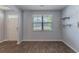 Bright room featuring hardwood floors, light grey walls, and natural light from the window at 131 Cloverleaf St, Summerville, SC 29483