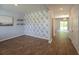 Stylish room featuring hardwood floors, decorative wallpaper, and modern lighting at 131 Cloverleaf St, Summerville, SC 29483