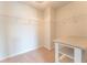 Walk-in closet featuring shelving and a center island with a light countertop and white base at 131 Cloverleaf St, Summerville, SC 29483