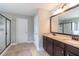 Bathroom features dual sink vanity with granite counters and glass door walk-in shower at 138 Shadybrook Dr, Summerville, SC 29486