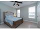 Bedroom with tiled floors, ceiling fan, and natural light. Perfect for Gathering and guests at 138 Shadybrook Dr, Summerville, SC 29486