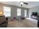 Spacious living room with a ceiling fan and neutral paint, perfect for Gathering gatherings at 138 Shadybrook Dr, Summerville, SC 29486