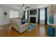 Comfortable living room featuring a fireplace, hardwood floors, and neutral decor at 138 Shadybrook Dr, Summerville, SC 29486