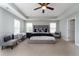Spacious main bedroom with tray ceiling, ceiling fan, and generous natural light from many windows at 138 Shadybrook Dr, Summerville, SC 29486