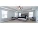 Spacious main bedroom with tray ceiling, ceiling fan, and generous natural light from many windows at 138 Shadybrook Dr, Summerville, SC 29486