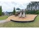 Community playground with a double slide and a wood chip base at 138 Shadybrook Dr, Summerville, SC 29486