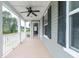 Inviting, spacious covered porch perfect for relaxing outdoors, with a ceiling fan and plenty of light at 138 Shadybrook Dr, Summerville, SC 29486