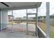 Relaxing screened porch with a view of the backyard, pond and fire pit at 138 Shadybrook Dr, Summerville, SC 29486
