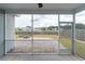Relaxing screened porch with a view of the backyard, pond and fire pit at 138 Shadybrook Dr, Summerville, SC 29486