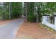 Well-maintained walking path alongside a landscaped area with a decorative wall at 138 Shadybrook Dr, Summerville, SC 29486