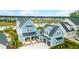 Aerial view of a charming home with lush landscaping, front porch and a detached two-car garage at 141 Sandy Bend Ln, Summerville, SC 29486