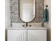 Close-up of a stylish bathroom vanity with a marble countertop and decorative mirror at 141 Sandy Bend Ln, Summerville, SC 29486