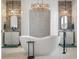 This luxurious bathroom features a stylish soaking tub, double sinks, and modern fixtures at 141 Sandy Bend Ln, Summerville, SC 29486