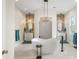 This luxurious bathroom features a stylish soaking tub, double sinks, and modern fixtures at 141 Sandy Bend Ln, Summerville, SC 29486