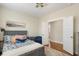 Cozy bedroom features a bed with decorative pillows, a whale stuffed animal, and a view through the doorway at 141 Sandy Bend Ln, Summerville, SC 29486