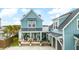 Beautiful home with a spacious front porch, inviting entrance and a detached two-car garage at 141 Sandy Bend Ln, Summerville, SC 29486