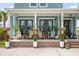 Charming front porch with seating area, plants, and an inviting entryway perfect for enjoying the outdoors at 141 Sandy Bend Ln, Summerville, SC 29486
