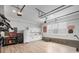 Bright garage featuring wood-look flooring, cabinetry, refrigerator, and tool storage at 141 Sandy Bend Ln, Summerville, SC 29486