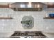 A detailed view highlights a professional-grade gas range with custom hood and open shelving at 141 Sandy Bend Ln, Summerville, SC 29486