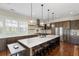 A spacious kitchen features a large island with seating, stainless steel appliances, and custom cabinetry at 141 Sandy Bend Ln, Summerville, SC 29486