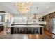 A kitchen features a central island, professional-grade appliances, and open layout to living spaces at 141 Sandy Bend Ln, Summerville, SC 29486