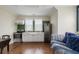 Charming kitchenette with white cabinetry, stainless steel appliances, and eat in kitchen/ living space at 141 Sandy Bend Ln, Summerville, SC 29486