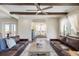 Open living room showcasing beamed ceilings and ample natural light at 141 Sandy Bend Ln, Summerville, SC 29486