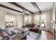Bright living room featuring beamed ceilings, fireplace, and comfortable seating at 141 Sandy Bend Ln, Summerville, SC 29486