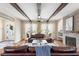 Cozy living room with fireplace, beamed ceilings, and plenty of natural light at 141 Sandy Bend Ln, Summerville, SC 29486