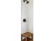 Close-up of a shower with white tiling, wood accent bench and modern fixtures at 141 Sandy Bend Ln, Summerville, SC 29486