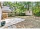 Backyard featuring a shed, lush greenery, and a concrete patio at 1429 Swamp Fox Ln, Charleston, SC 29412