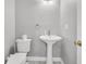 Bathroom with a toilet and pedestal sink at 1429 Swamp Fox Ln, Charleston, SC 29412