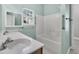 Bathroom featuring double sinks, a window overlooking the exterior, and a bathtub and shower combination at 1429 Swamp Fox Ln, Charleston, SC 29412