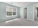 Bedroom with carpeted floors, an open door, and a large window offering lots of natural light at 1429 Swamp Fox Ln, Charleston, SC 29412