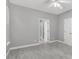 Neutral bedroom with light gray walls, hardwood floors, and natural light from windows at 1429 Swamp Fox Ln, Charleston, SC 29412