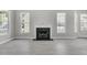 Bright Living Room with fireplace and multiple windows at 1429 Swamp Fox Ln, Charleston, SC 29412