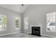 Bright living room featuring a fireplace and large windows at 1429 Swamp Fox Ln, Charleston, SC 29412