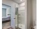 En-suite bathroom features a walk-in shower with a glass door and neutral-colored tile at 143 West Bradford Pointe Dr, Summerville, SC 29486