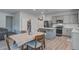 Cozy dining area adjacent to the modern kitchen with stainless appliances and ample counter space at 143 West Bradford Pointe Dr, Summerville, SC 29486