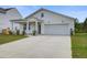Well-maintained single-story home with attached garage, landscaping, and a concrete driveway at 143 West Bradford Pointe Dr, Summerville, SC 29486