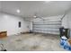 Spacious two-car garage with a concrete floor and an automatic door opener at 143 West Bradford Pointe Dr, Summerville, SC 29486