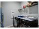 Laundry room features washer and dryer, and storage shelving for added convenience at 143 West Bradford Pointe Dr, Summerville, SC 29486