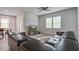 Bright living room boasts a ceiling fan, wood floors, and a sliding glass door leading outside at 143 West Bradford Pointe Dr, Summerville, SC 29486