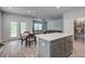 Open living space featuring a kitchen, dining area, and living room with lots of light at 143 West Bradford Pointe Dr, Summerville, SC 29486