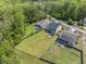 Green home featuring a large fenced yard with a lovely patio at 1489 Brockenfelt Dr, Charleston, SC 29414