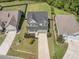 Aerial view of a two-story home highlighting its driveway, landscaping, and overall neighborhood at 1489 Brockenfelt Dr, Charleston, SC 29414