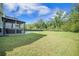 Grassy backyard features a gazebo and mature trees, offering a peaceful outdoor space at 1489 Brockenfelt Dr, Charleston, SC 29414