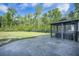 Expansive backyard with stone patio, lush lawn, and a hot tub under a gazebo, perfect for outdoor relaxation at 1489 Brockenfelt Dr, Charleston, SC 29414
